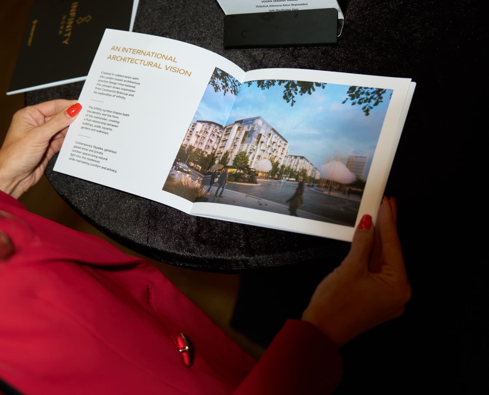 Woman holding an Infinity Nord brochure.