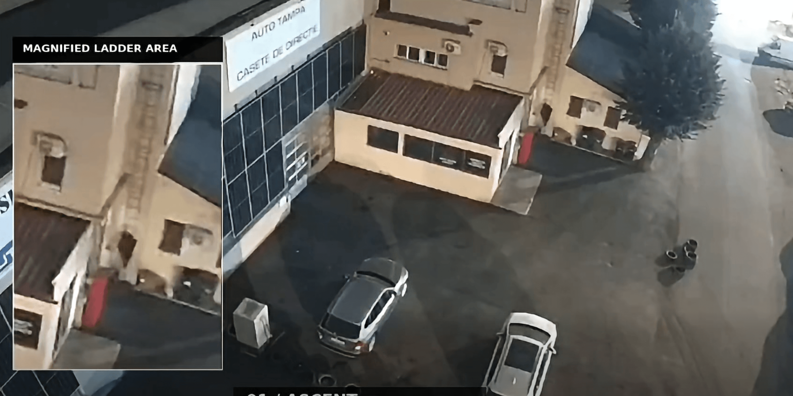 Man climbs ladder on industrial platform building moments before the fire.