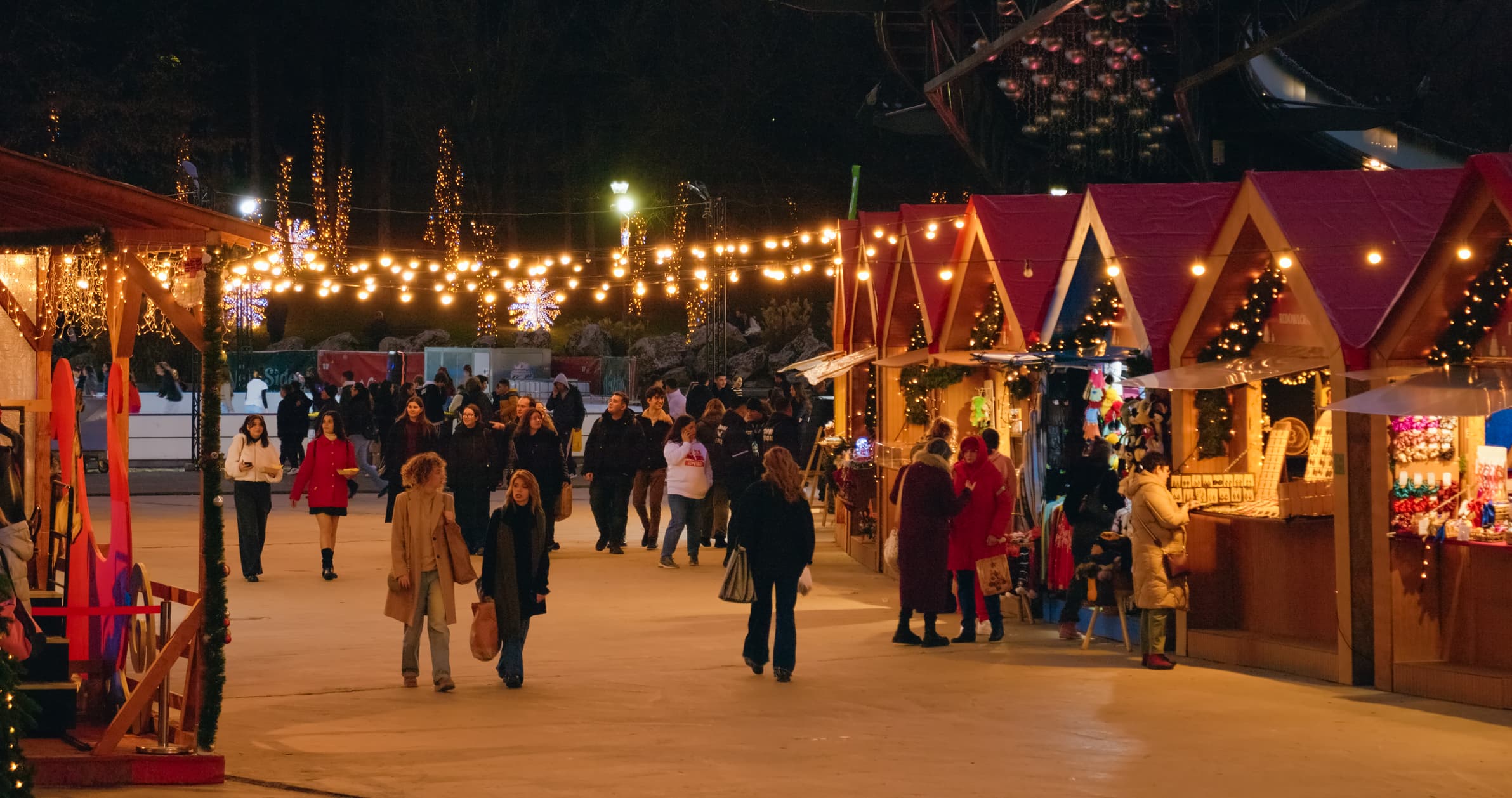 People at older edition of a Christmas market in Bucharest.
