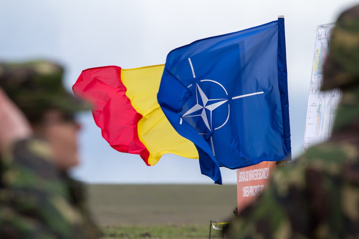 Romanian and NATO flags.