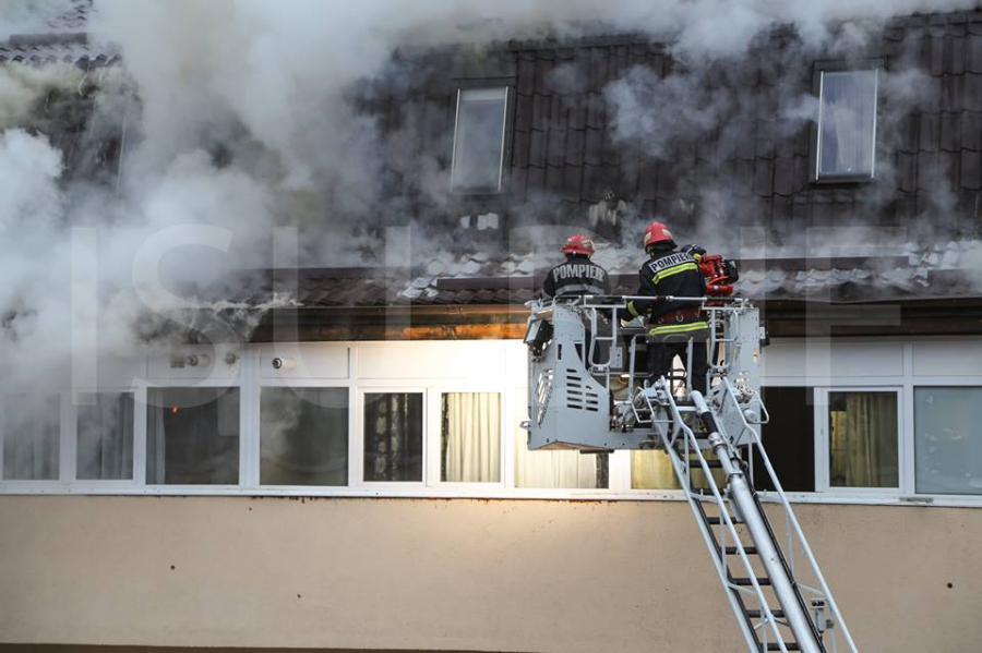 Some 400 evacuated as the attic of an apartment building catches fire ...