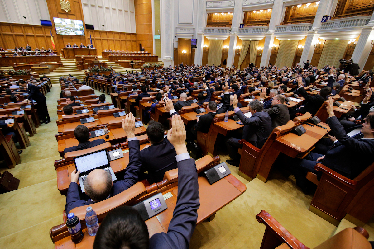 Despite opposition's vocal protests, Romania's lawmakers pass special pension bill